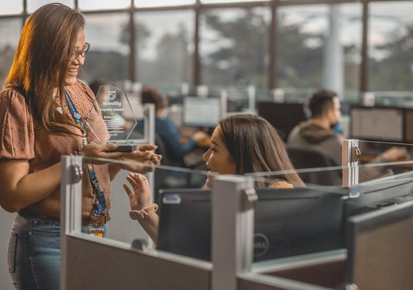 What role does corporate training play in enhancing employee loyalty in UK firms?